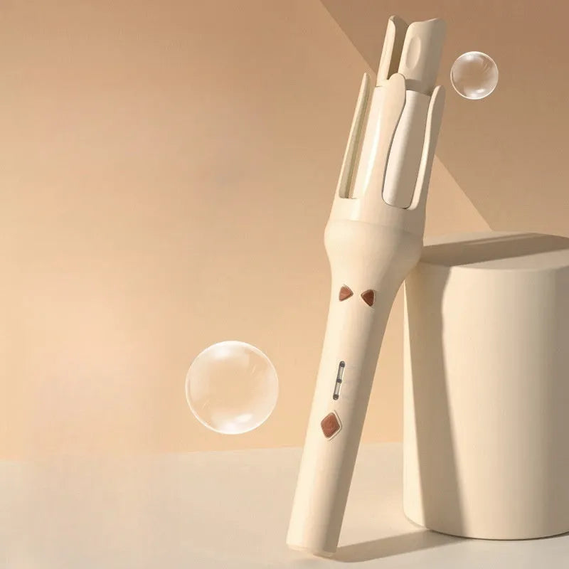 White and pink automatic hair curler with 32mm ceramic barrel and auto-clamp feature on a table.