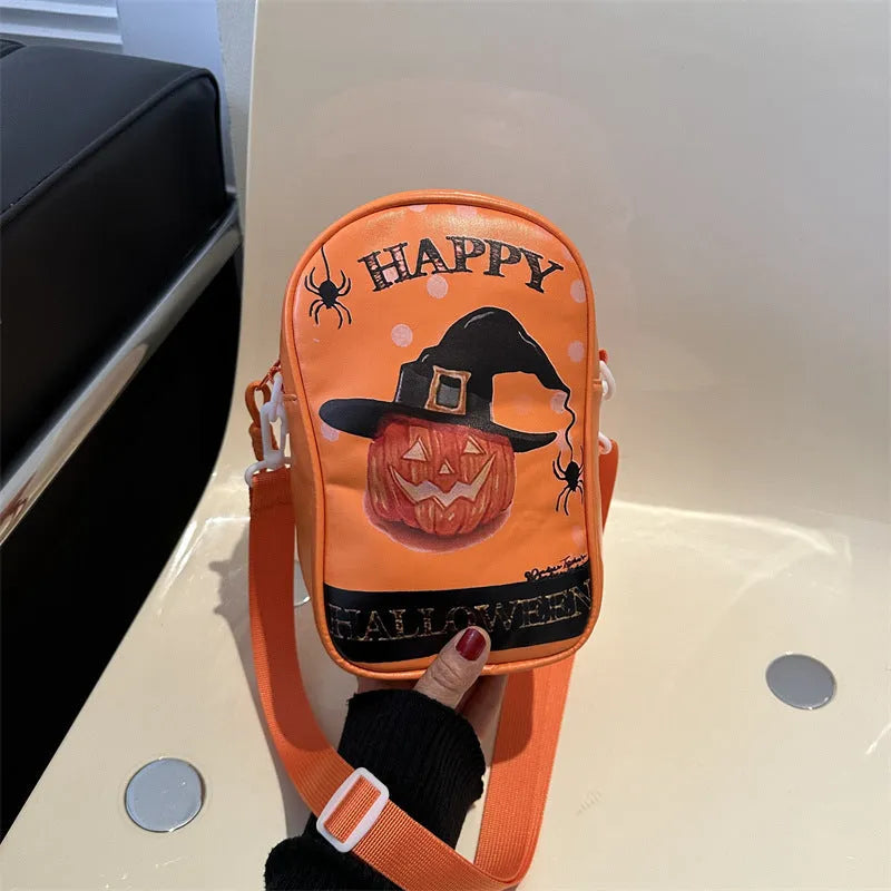 Black mini square crossbody bag with orange Halloween graffiti print of cartoon pumpkin, ghost, and bat.