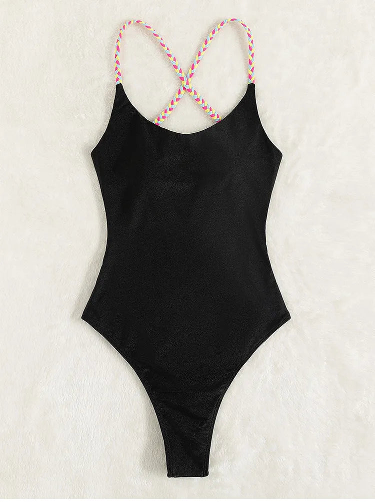 Black backless one-piece swimsuit for women on a mannequin, sleeveless design.