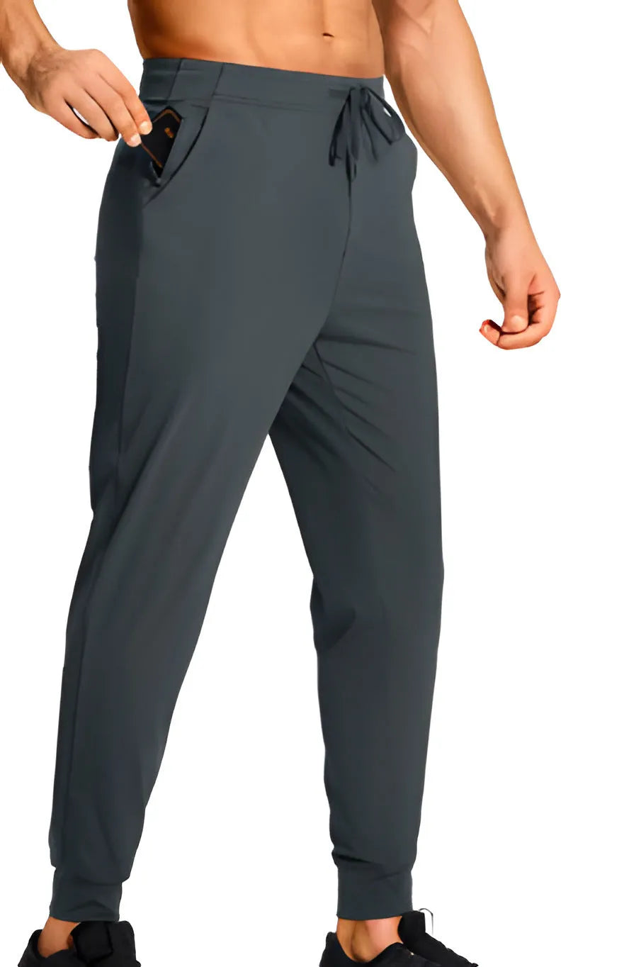 Men's loose fit casual trousers in solid colour polyester fabric showing relaxed cut and casual styling