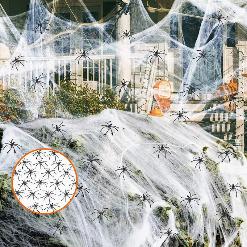 Halloween cotton spider web decoration pack with white plastic spiders draped over a branch