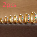 Gold, rose gold, and silver coloured perforated circle zircon stud earrings in various sizes from 5mm to 12mm.
