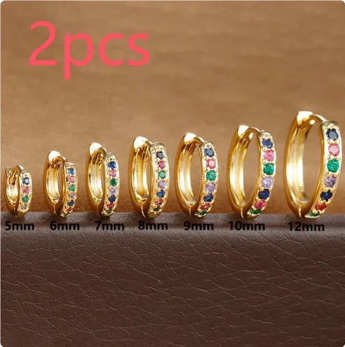 Gold, rose gold, and silver coloured perforated circle zircon stud earrings in various sizes from 5mm to 12mm.