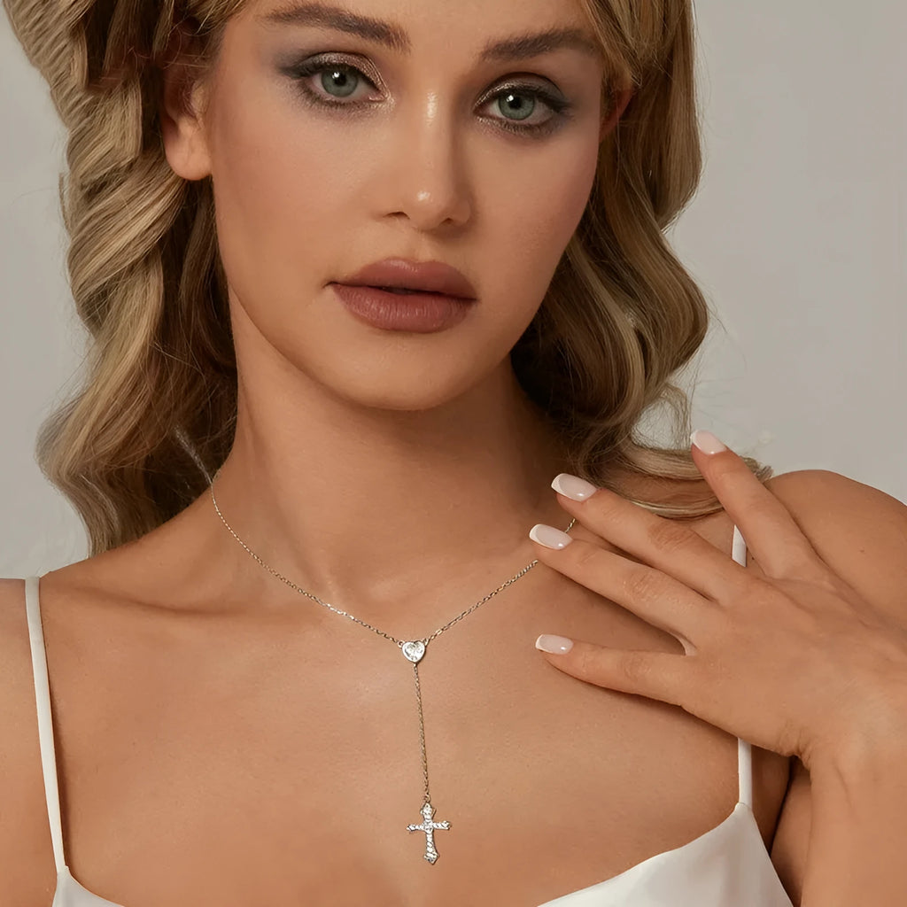 Women's silver love cross necklace with V-neck pendant on O-ring chain.
