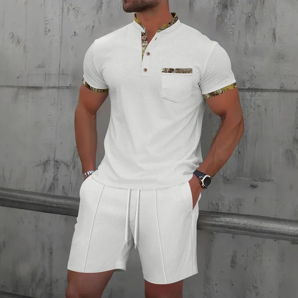 Man wearing a grey waffle knit zip-up polo collar top and matching shorts from a two-piece summer suit.