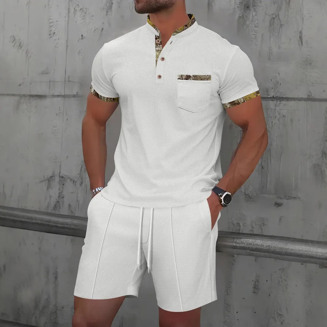 Man wearing a grey waffle knit zip-up polo collar top and matching shorts from a two-piece summer suit.
