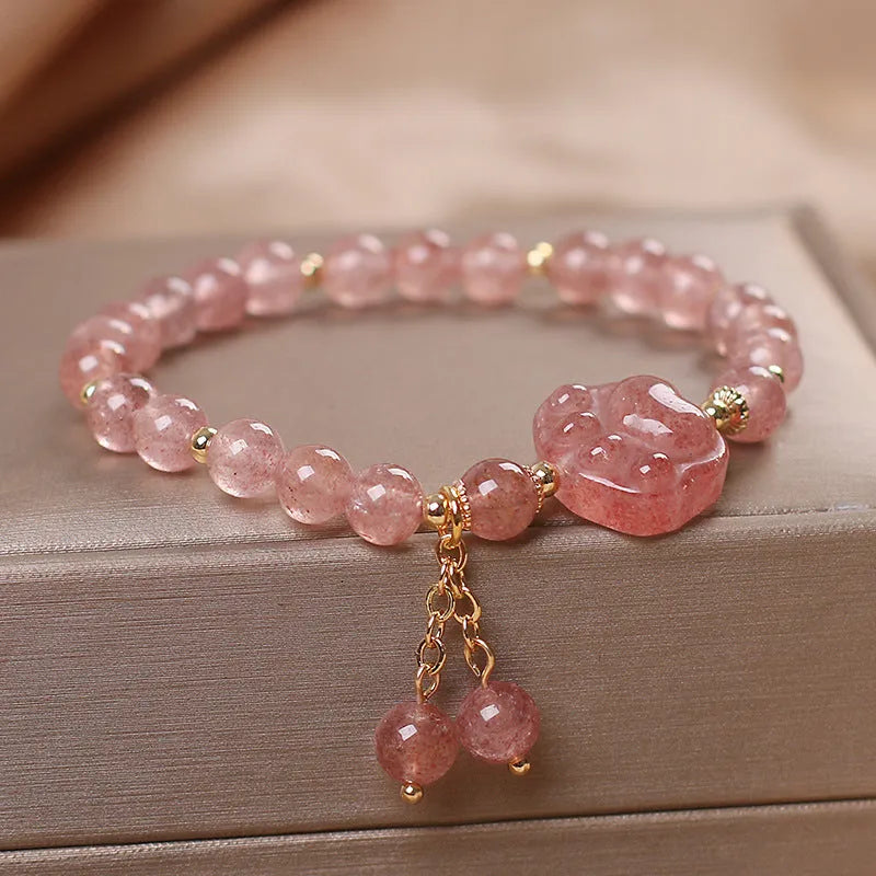 Women's double layer crystal bracelet with lucky cat charm and red cat's eye flowers in ethnic fairy style.
