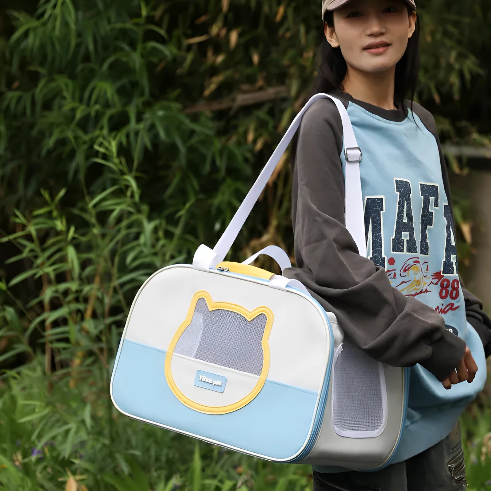 Blue foldable cat backpack made from Oxford cloth with contrast colour pattern and shoulder straps