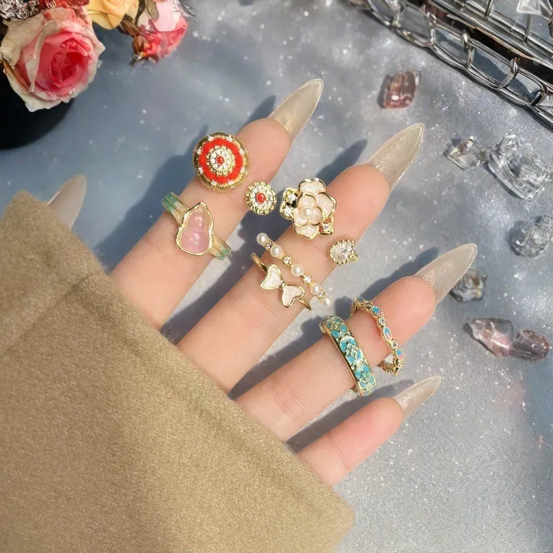 Adjustable copper ring with oil drip finish, featuring a gourd design and inlaid zircon stones.