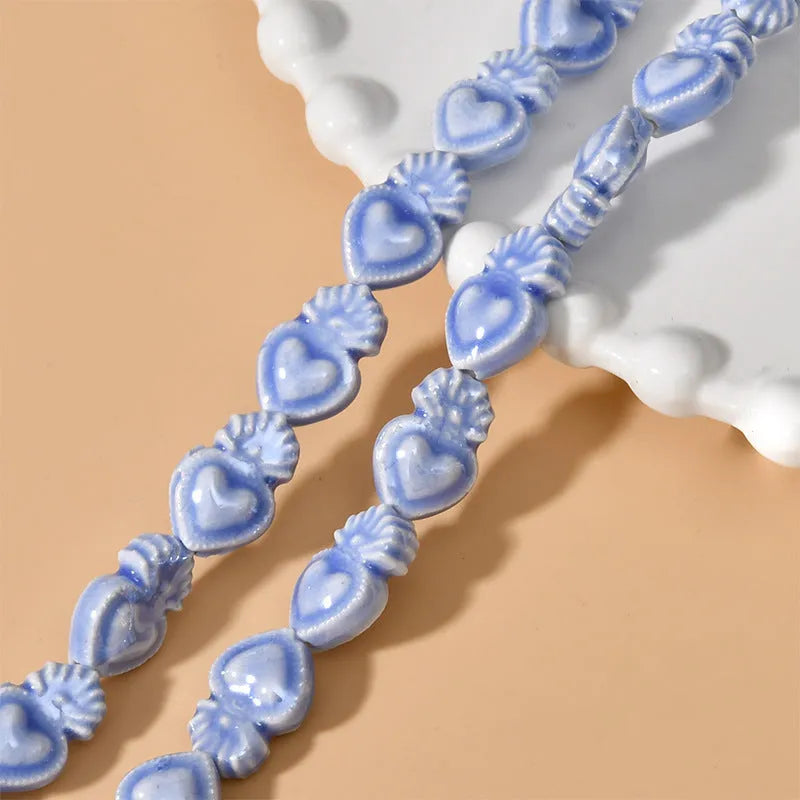 Love heart torch-shaped ceramic beads, about 10 x 15mm with 1.7mm straight hole, in cream white and other colours.