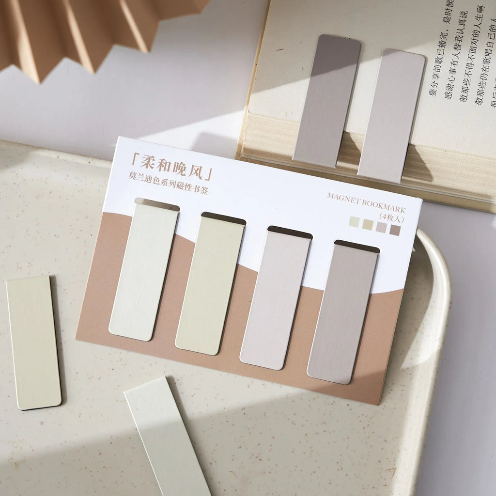 Set of four miniature magnetic bookmarks in soft Morandi series colour blocks on a white background.