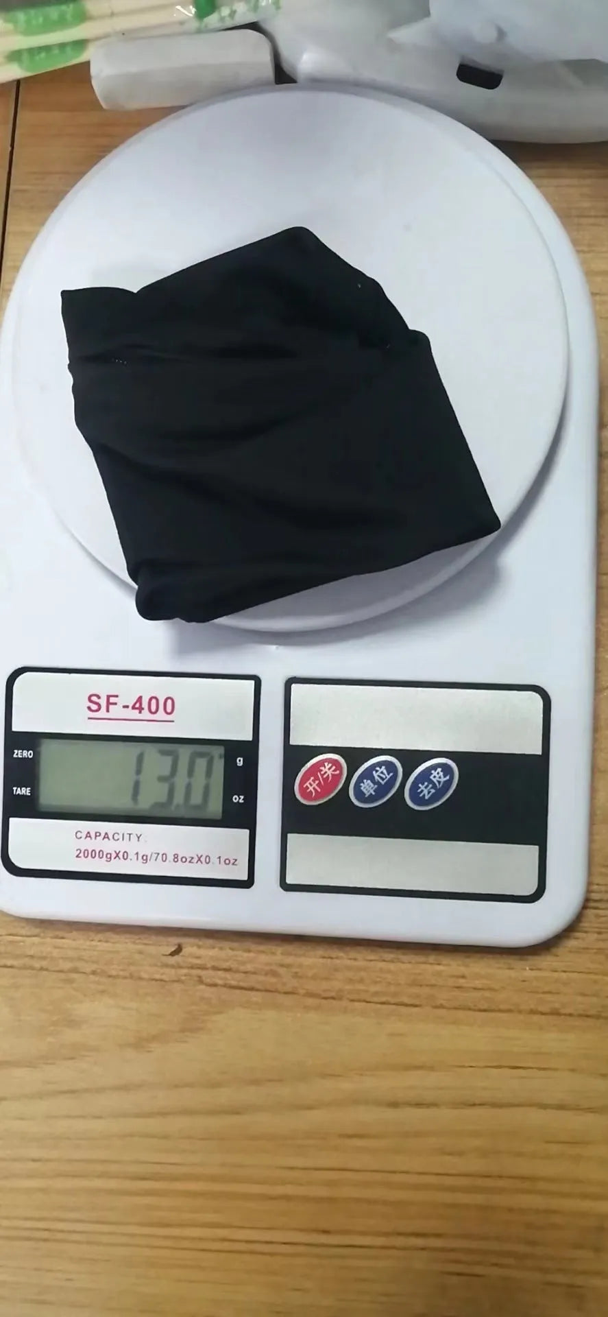 Adjustable fitness wrist bag with armband sleeve for mobile phone, shown in packaging.
