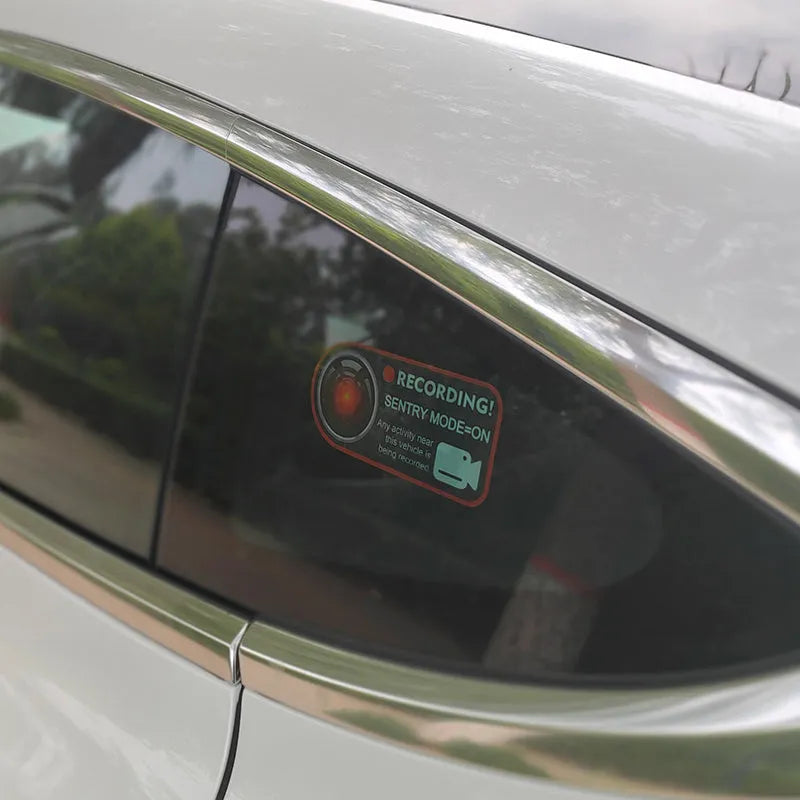 Tesla Sentry Mode warning stickers with electrostatic PVC construction measuring 11x5 cm