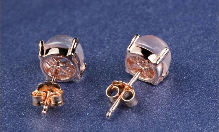 Korean style synthetic ross quartz stud earrings for women with rose gold plating and drop-shaped crystal inlay