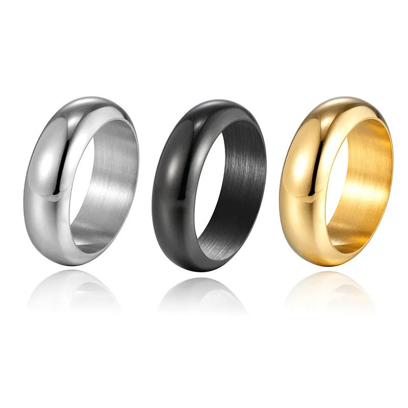 Glossy electroplated titanium steel ring in gold, black and steel colours showing metallic finish