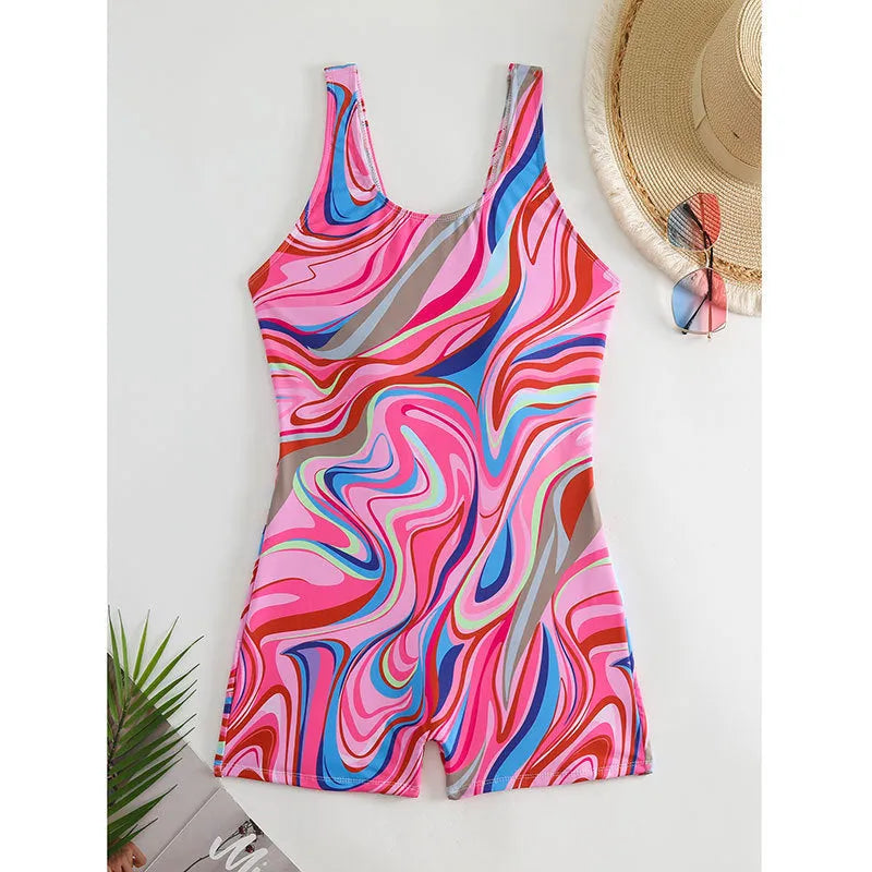 Women's printed high-waisted backless one-piece swimsuit on a white background.