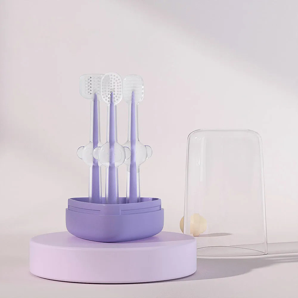 Blue, green, and purple pet toothbrushes with soft silicone bristle heads for dogs and cats.