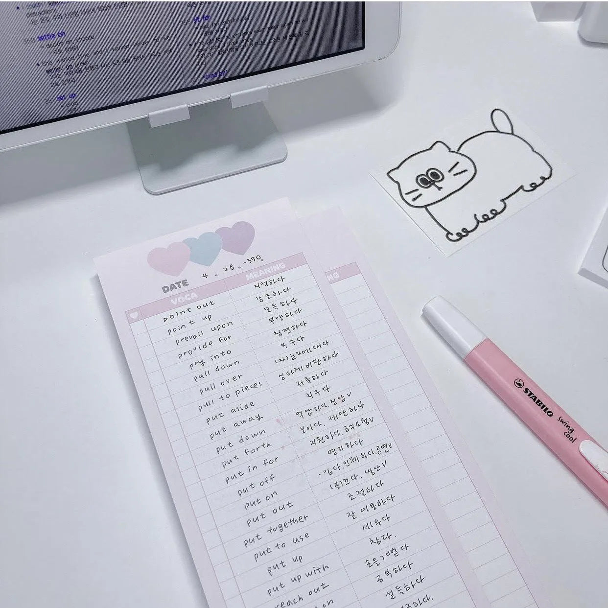 Vertical English word notepad in blue, pink, or purple cover, showing double-sided printed pages.