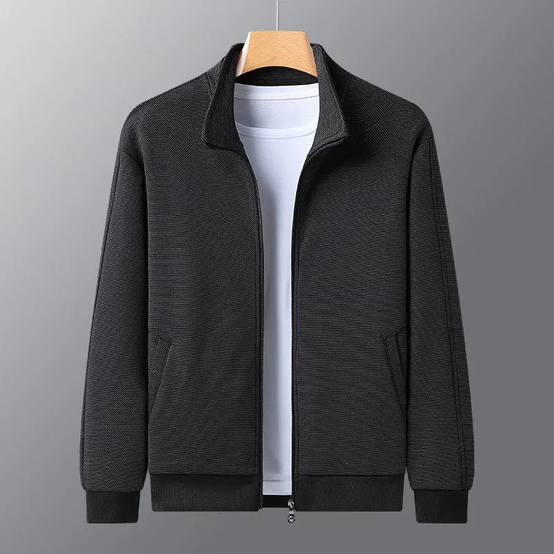 Man wearing a grey athletic-fit casual jacket with a stand-up collar and front zip.