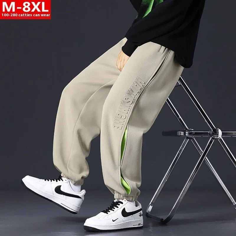 Men's loose cotton trousers with stitching detailing and ankle banding in grey green colour