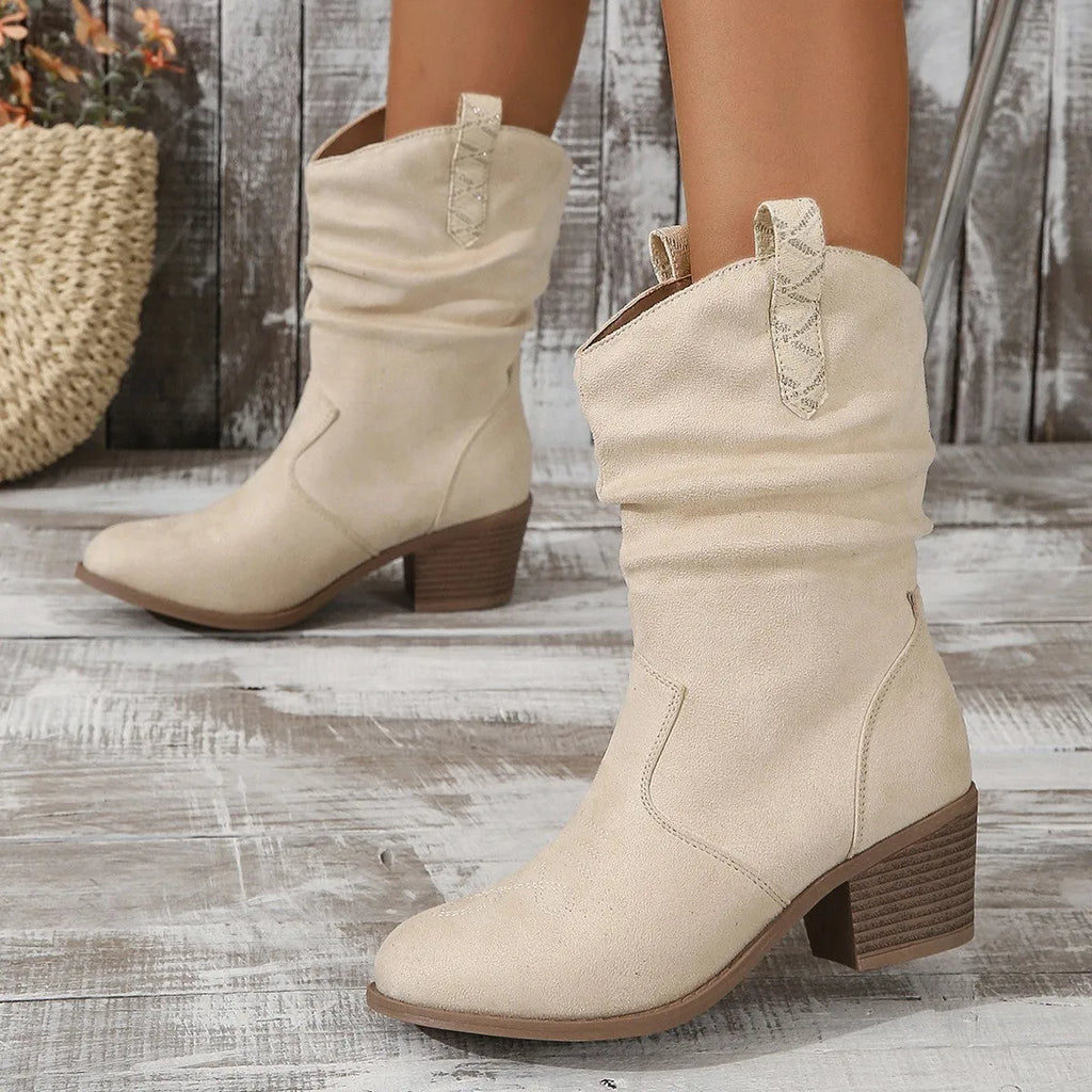 Women's suede mid-calf boots with a round toe and short stout heel on a rubber sole.