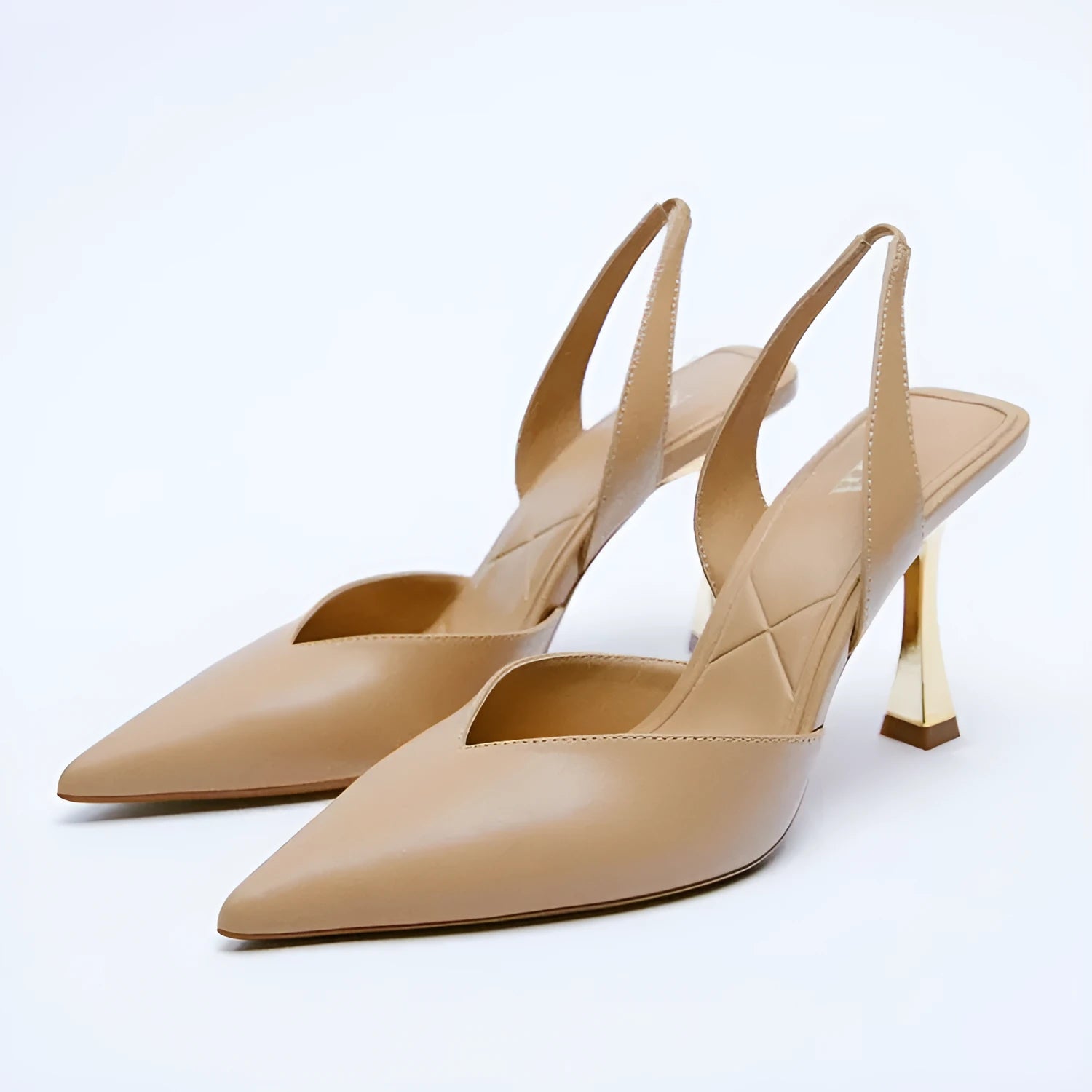 Women's patent leather pointed toe high heels in apricot colour, showcasing shallow mouth design.