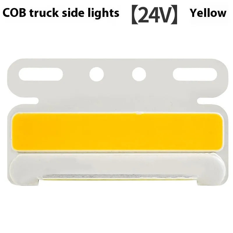Aluminium alloy COB LED truck side light projecting bright white light onto ground next to tyre.