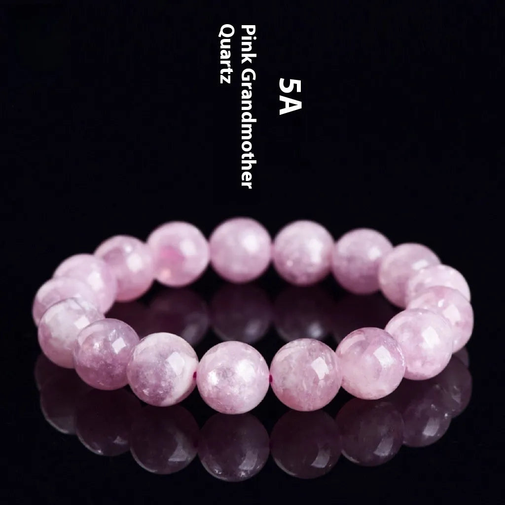 Grandmother crystal bracelet with polished geometric beads in purple on a wrist.