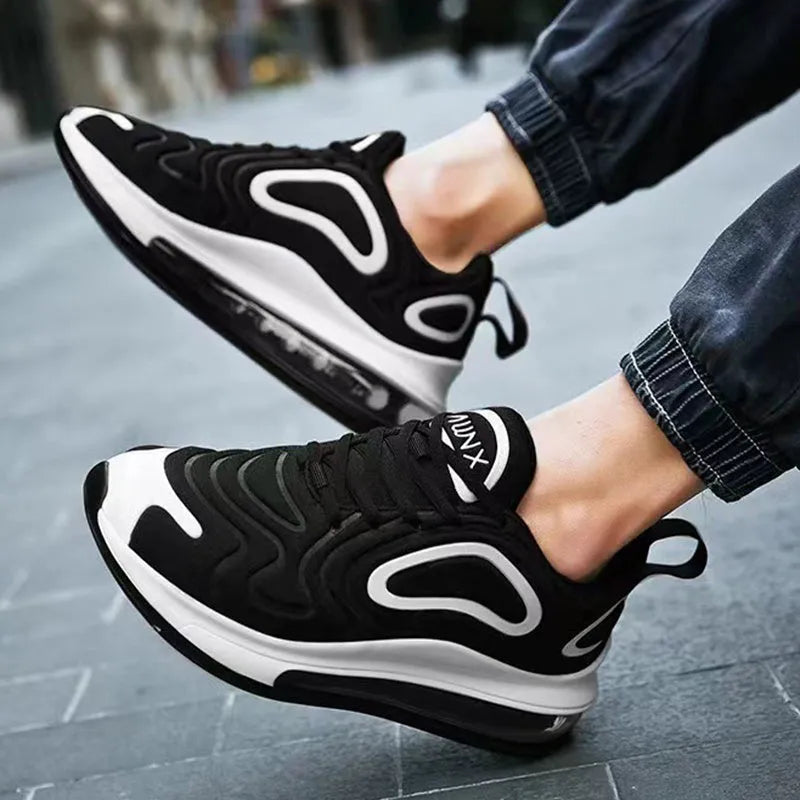 Men's black lace-up sneakers with a thick sole and round toe for outdoor sports.
