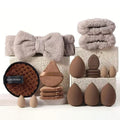Beauty tool combination set with multiple pieces in brown, pink, and purple colours for face wash and makeup application