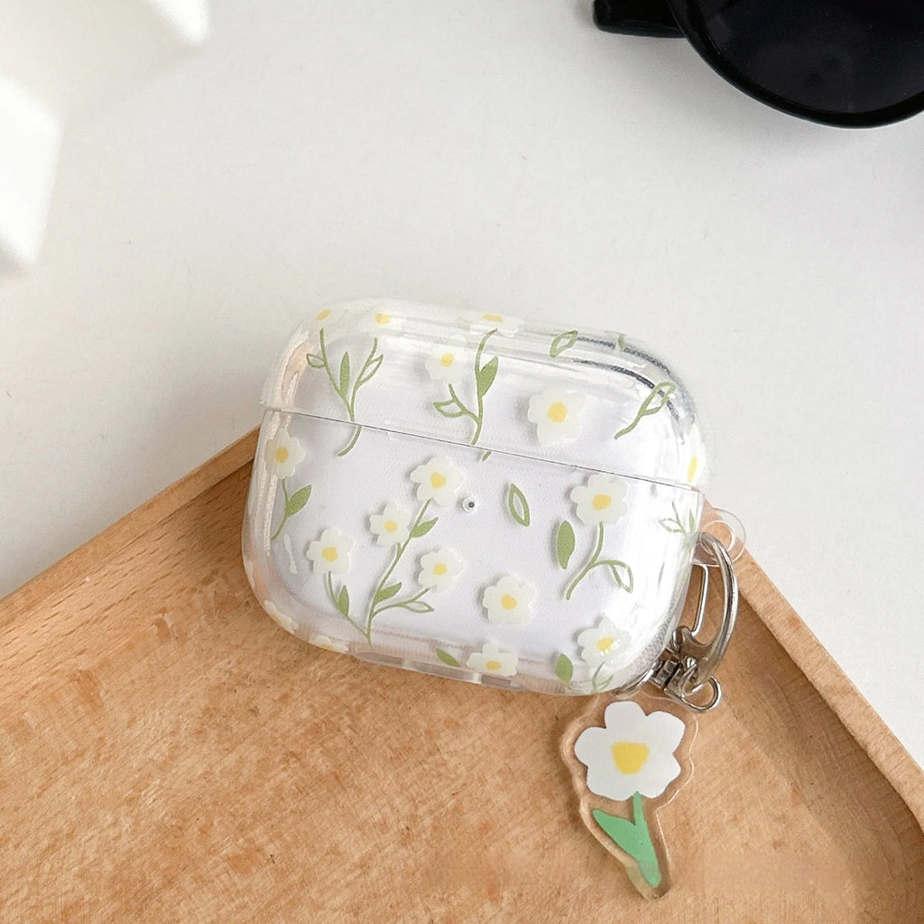 White floral pattern clear TPU protective case for Apple AirPods on a charging case.