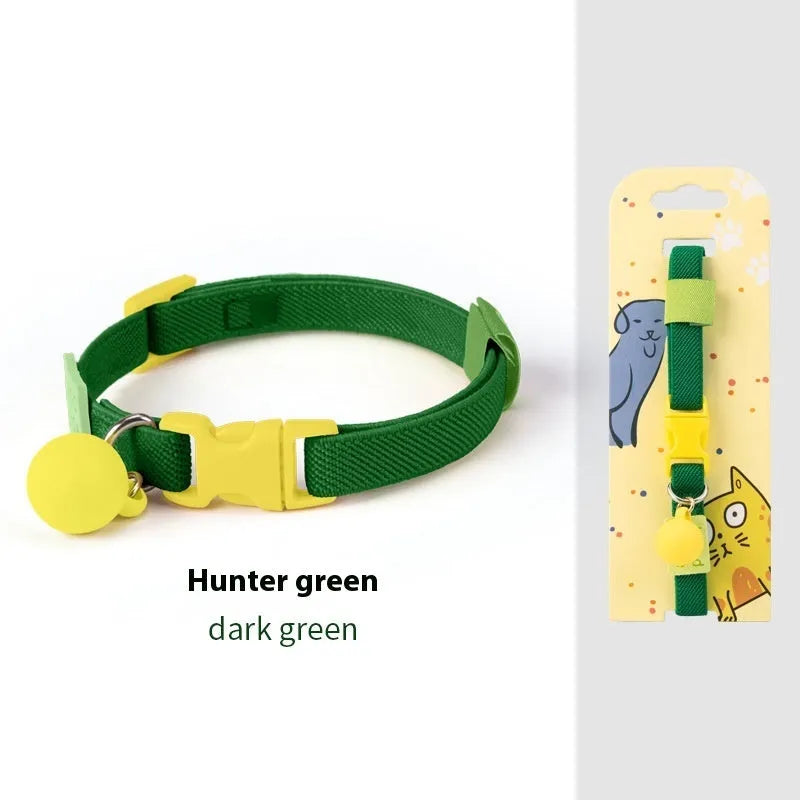 A stretchy yellow polyester dog collar for small breeds, shown adjusted to fit, with a metal D-ring.