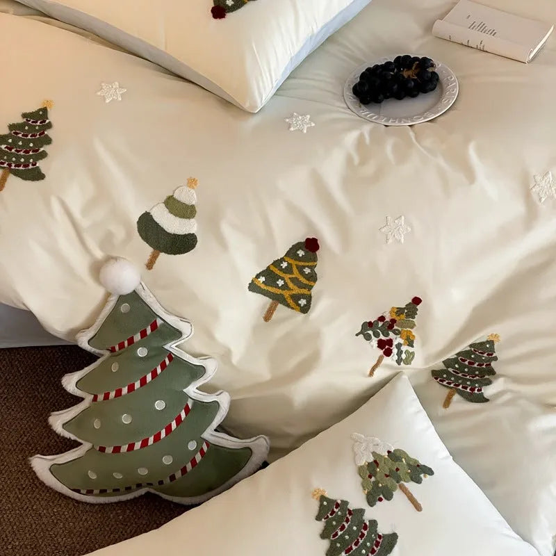 Cream Blue pure cotton duvet cover with raised white Christmas tree embroidery, paired with a fitted sheet and pillowcases.