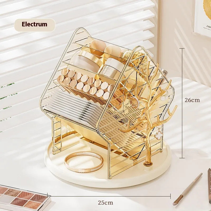 Rotating clear plastic cosmetics organiser box with multiple tiers on a wooden dresser.