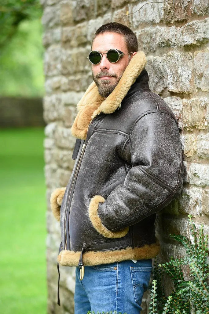 Men's brown retro western-style synthetic leather winter coat with side pockets on a mannequin.