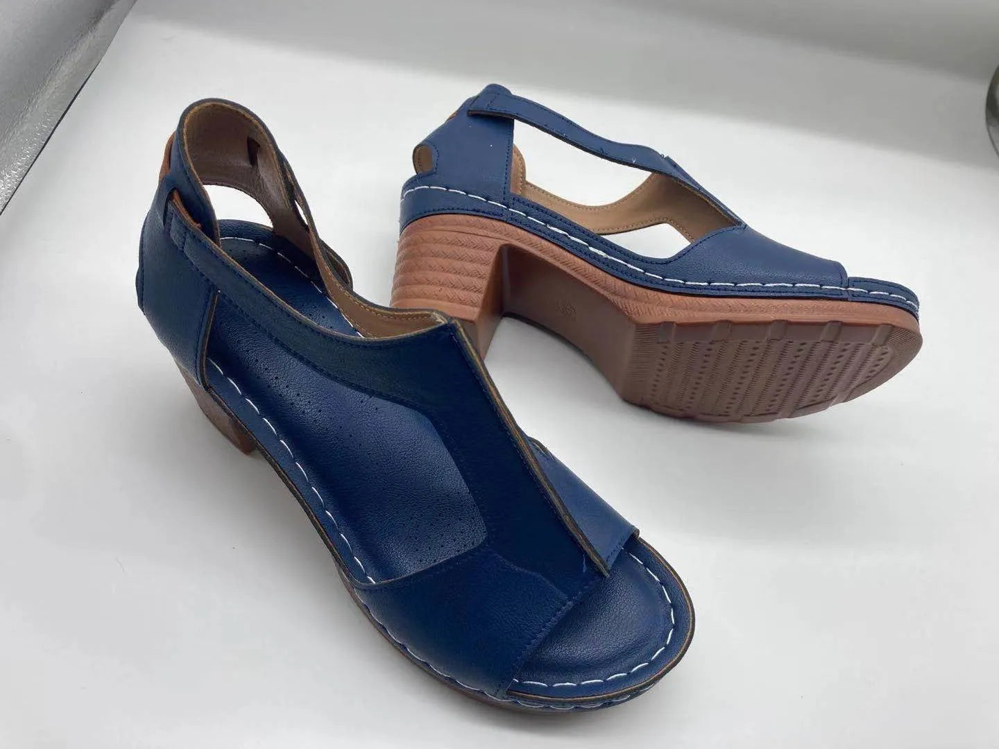 Women's peep toe wedge sandal with buckle on low heel, open fish mouth toe, in light brown