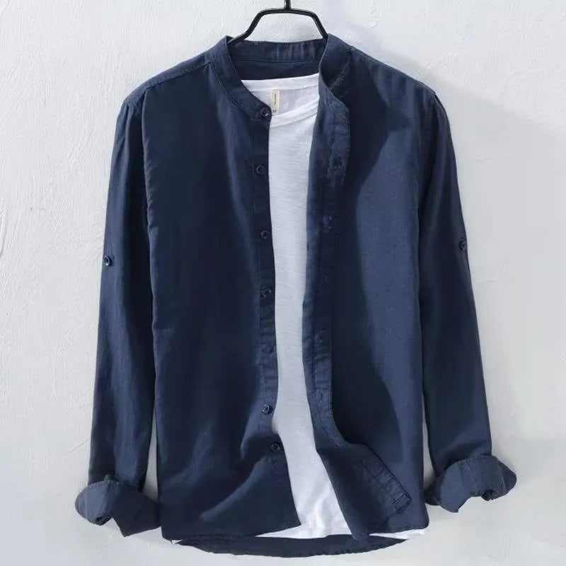 A man's loose-fitting, long-sleeve casual shirt in a cotton linen blend, shown in a solid colour.