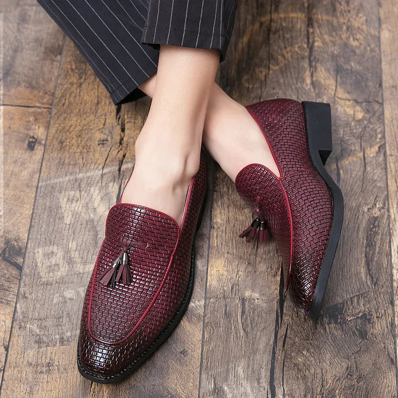 Men's black pointed toe slip-on shoe with a tassel on the low-top PU upper.