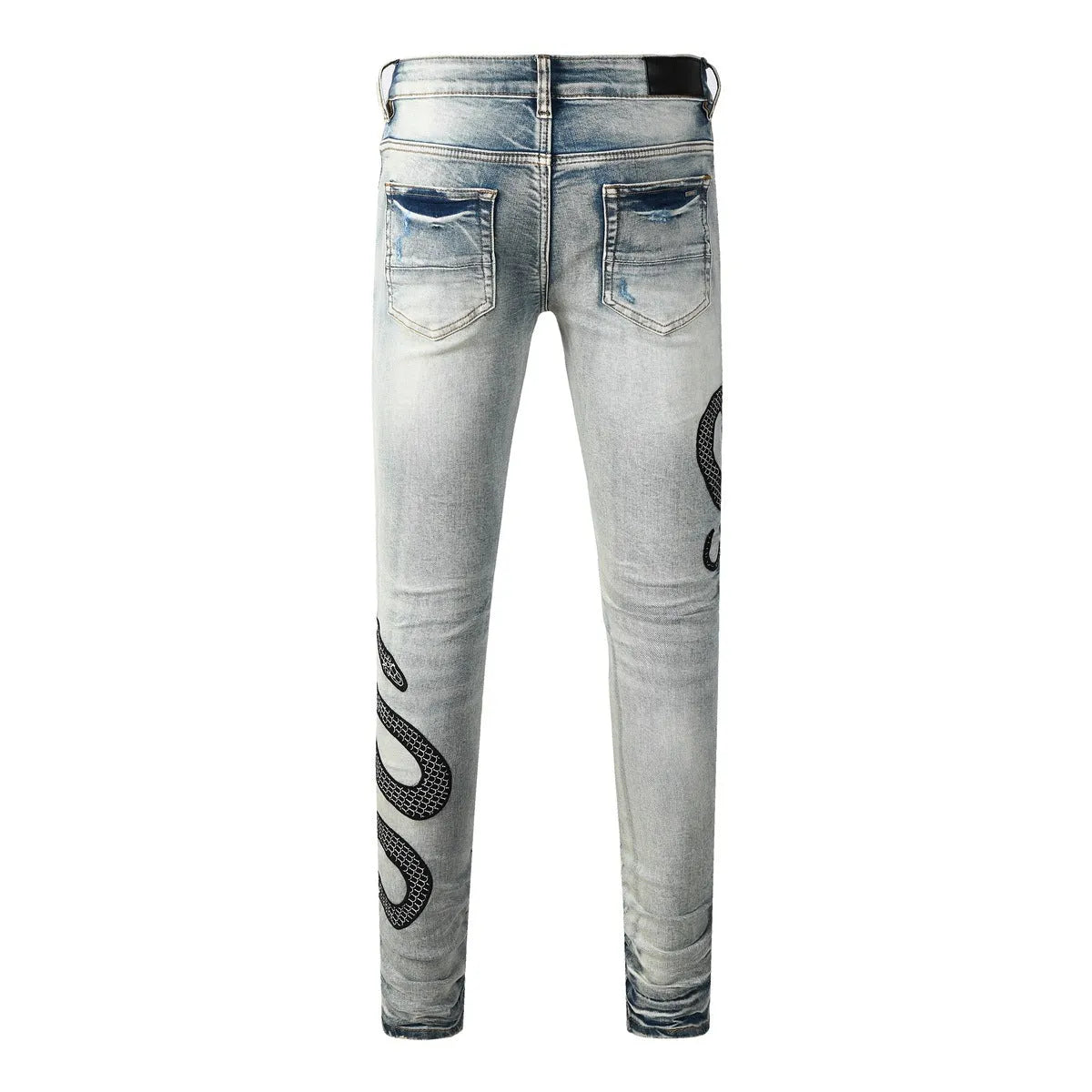 Blue distressed street fashion skinny jeans with a button fly and tight leg fit.