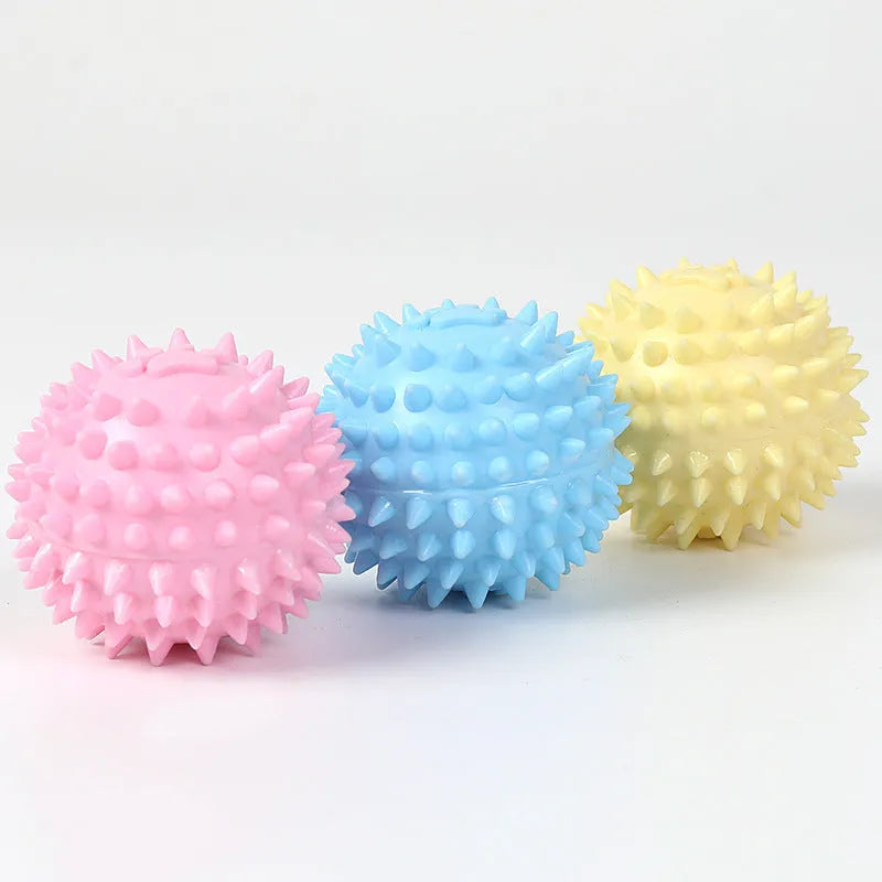 Blue TPR dog chewing ball with textured footprint design for teeth cleaning, 6cm diameter