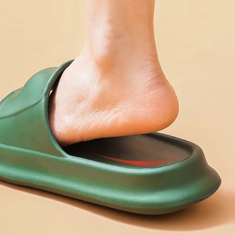 A pair of thick-soled EVA flip-flop slippers on a bathroom floor, showcasing non-slip tread and available colour options.