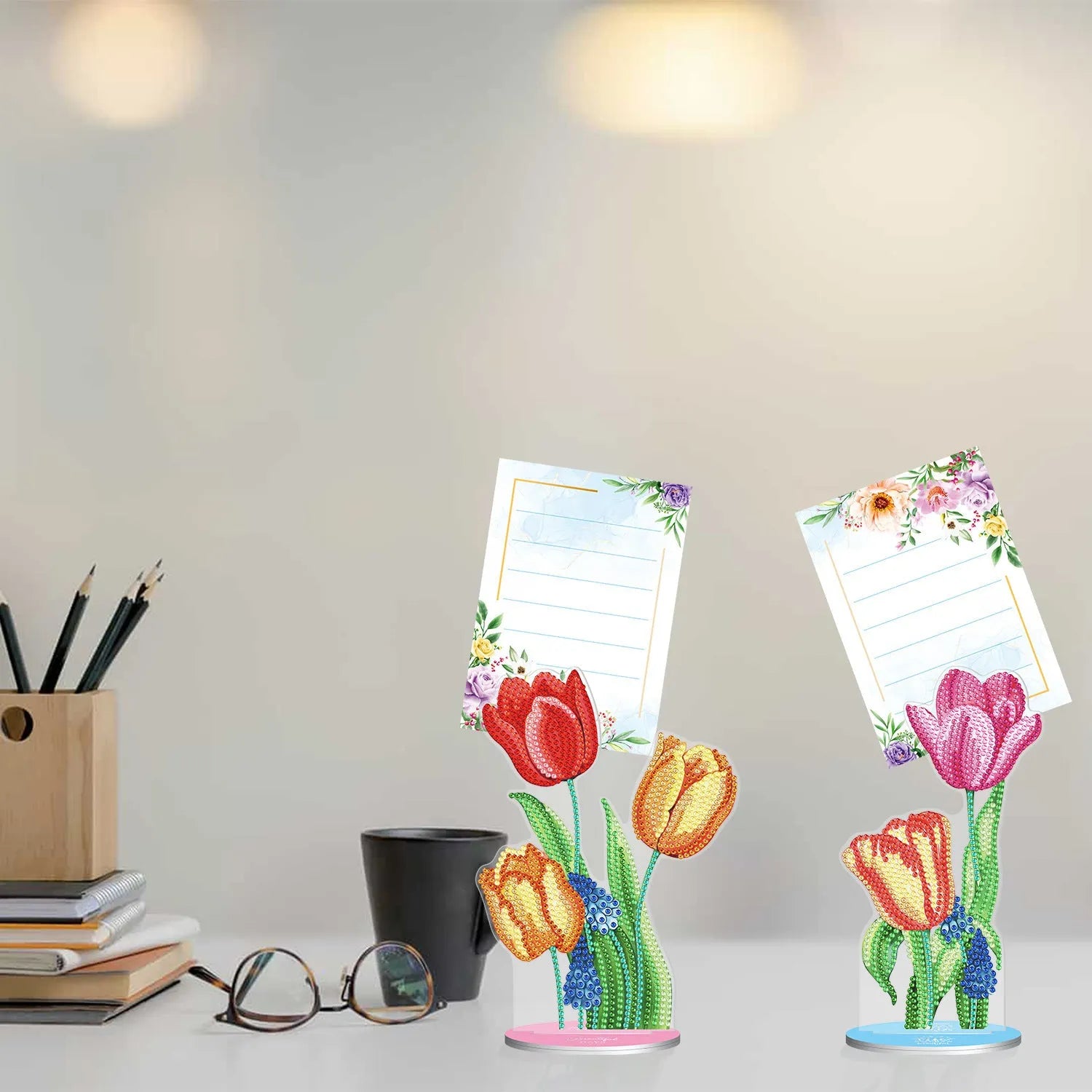 Handmade diamond painting decorative note clip on a desktop.