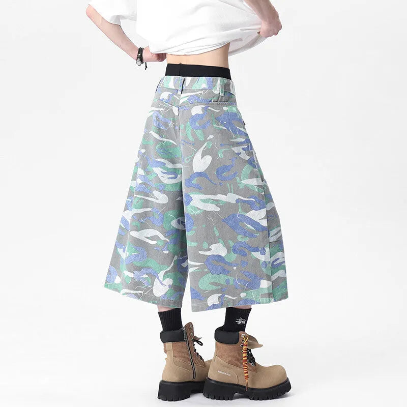 Women's cropped camouflage denim cargo trousers with a pocket on the leg.