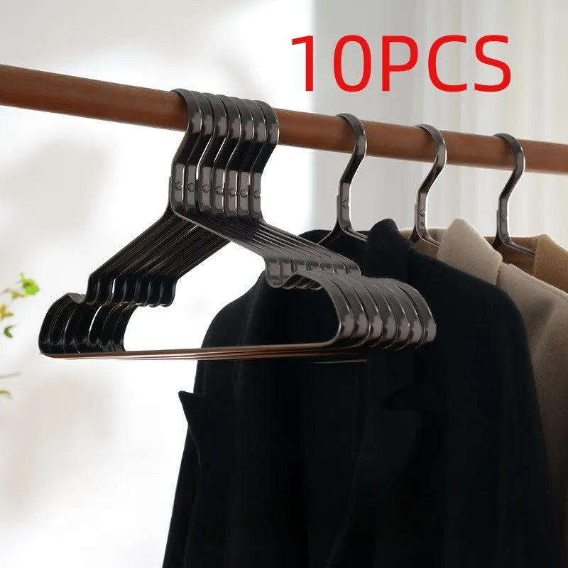 Elegant black non-slip metal clothes hanger for suits and trousers.
