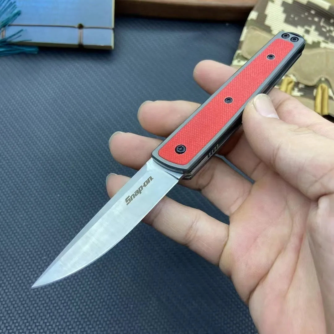 Folding fruit knife with stainless steel blade in black, brown, or red colour options showing 17cm length