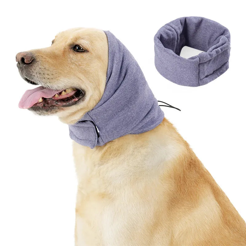 Dog wearing black calming hoodie covering ears with multi-purpose design for noise reduction and hair management
