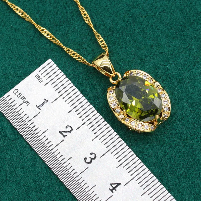 Olive green women's rhinestone jewellery suit with snake bones chain necklace, earrings, and ring on copper.