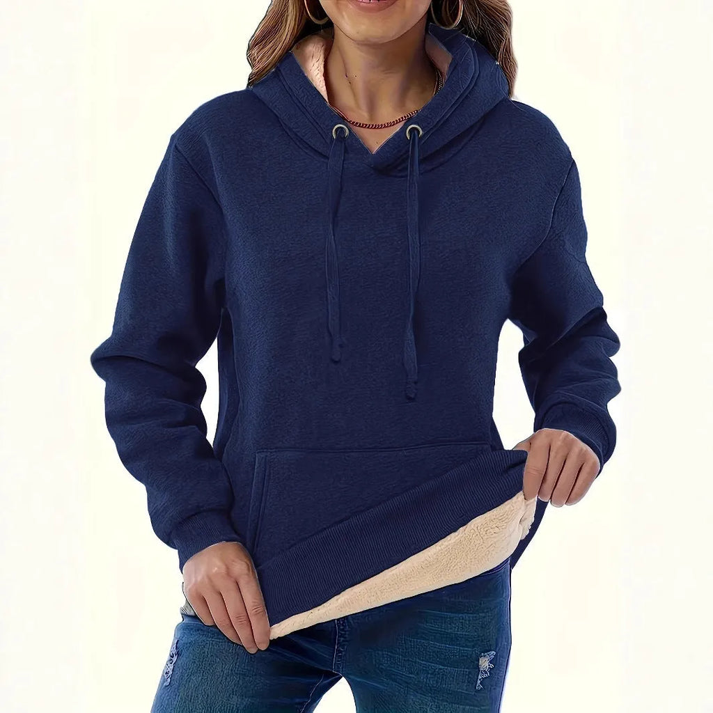 Women's loose hooded sweater with pockets in black colour showing 3D pattern detail