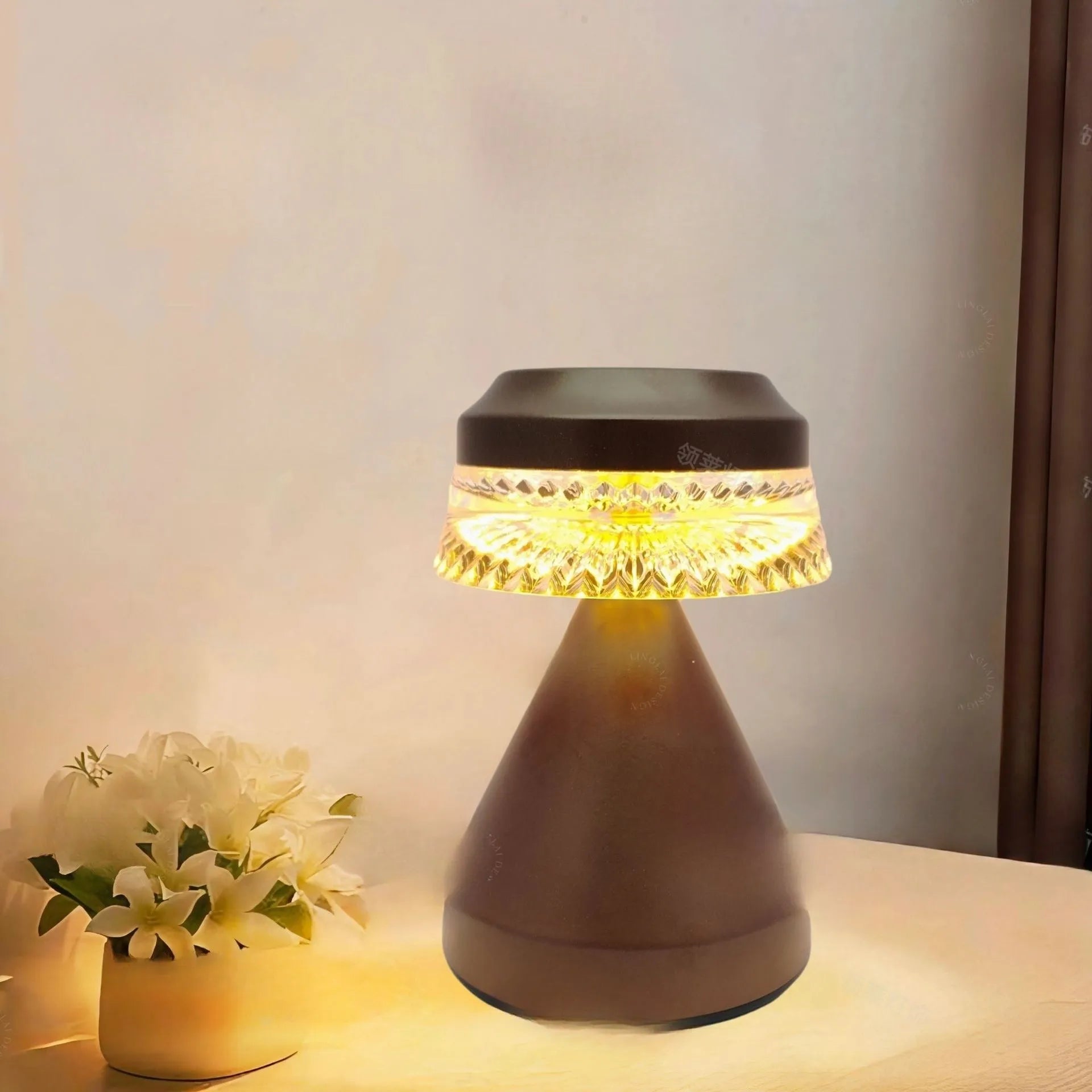 Compact USB rechargeable LED night light in black, brown, and orange colour options on a table.