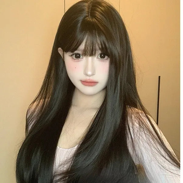 A dark brown long straight synthetic wig with a fringe on a wig stand.